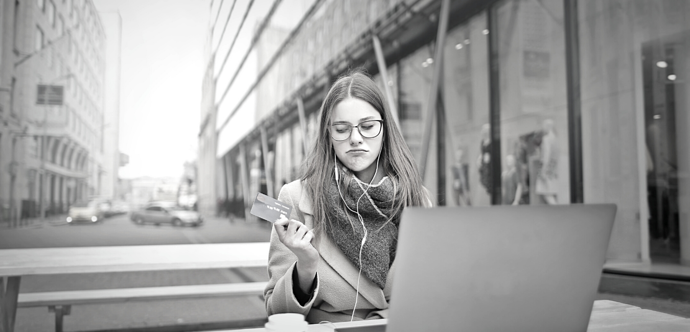 Woman using her credit card to purchase online